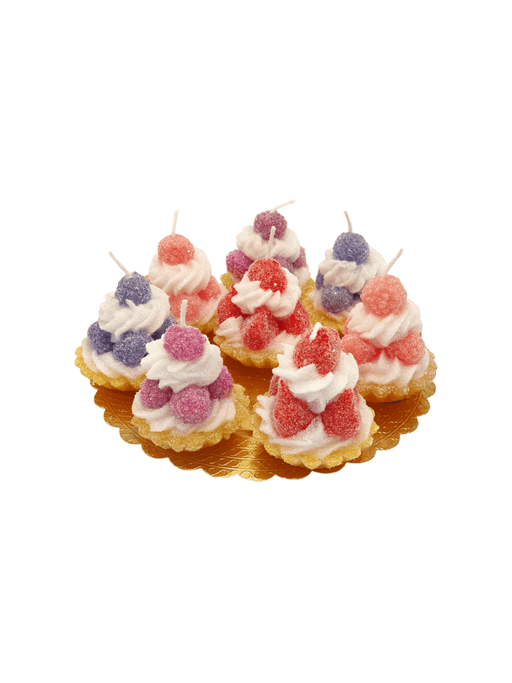 Decorative tarts with colourful fruit shaped candles from Cereria Introna on a transparent background | Twentyseven Toronto