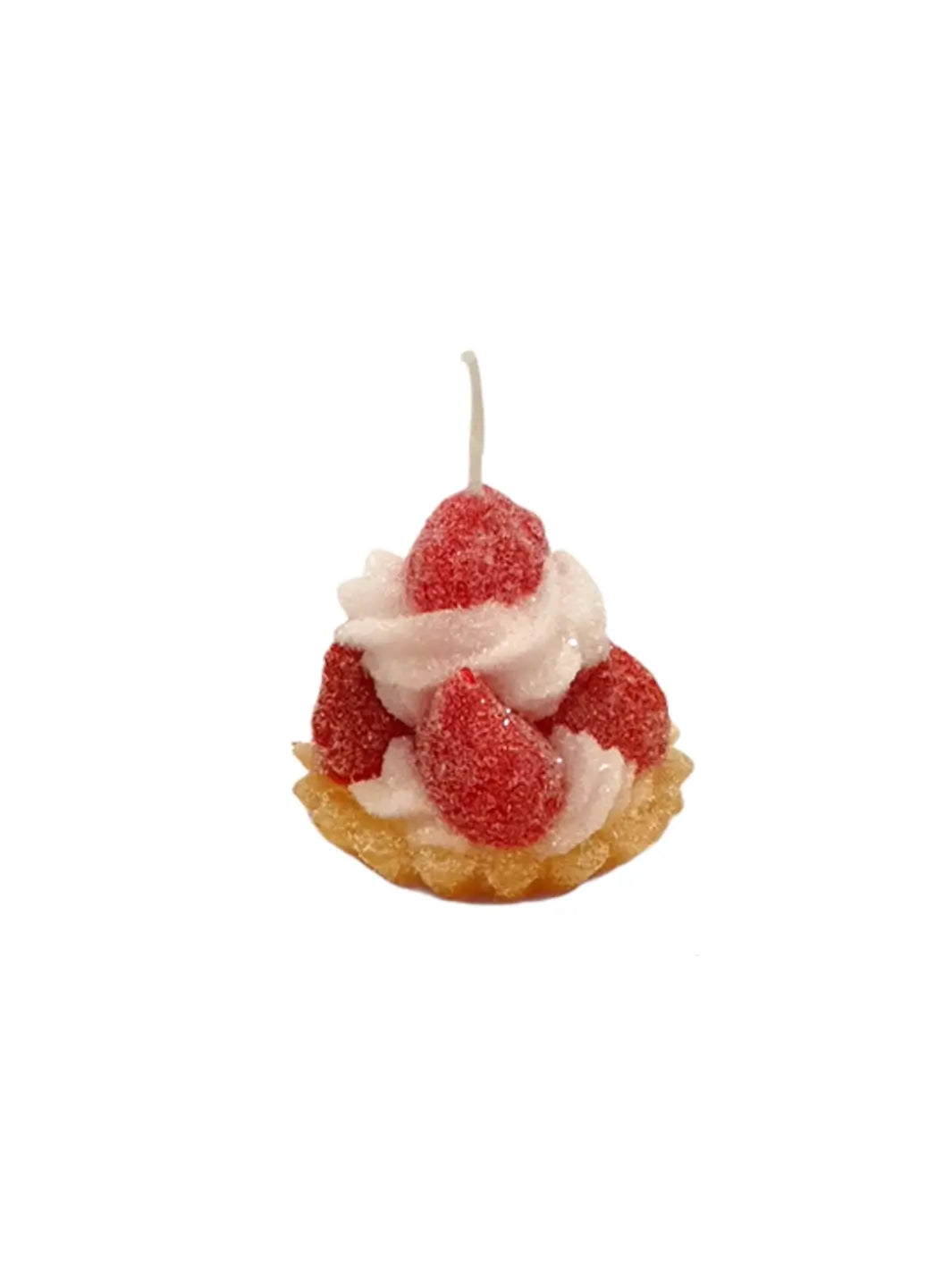 Candle shaped like a tart with white frosting and red berries from Cereria Introna on a white background | Twentyseven Toronto