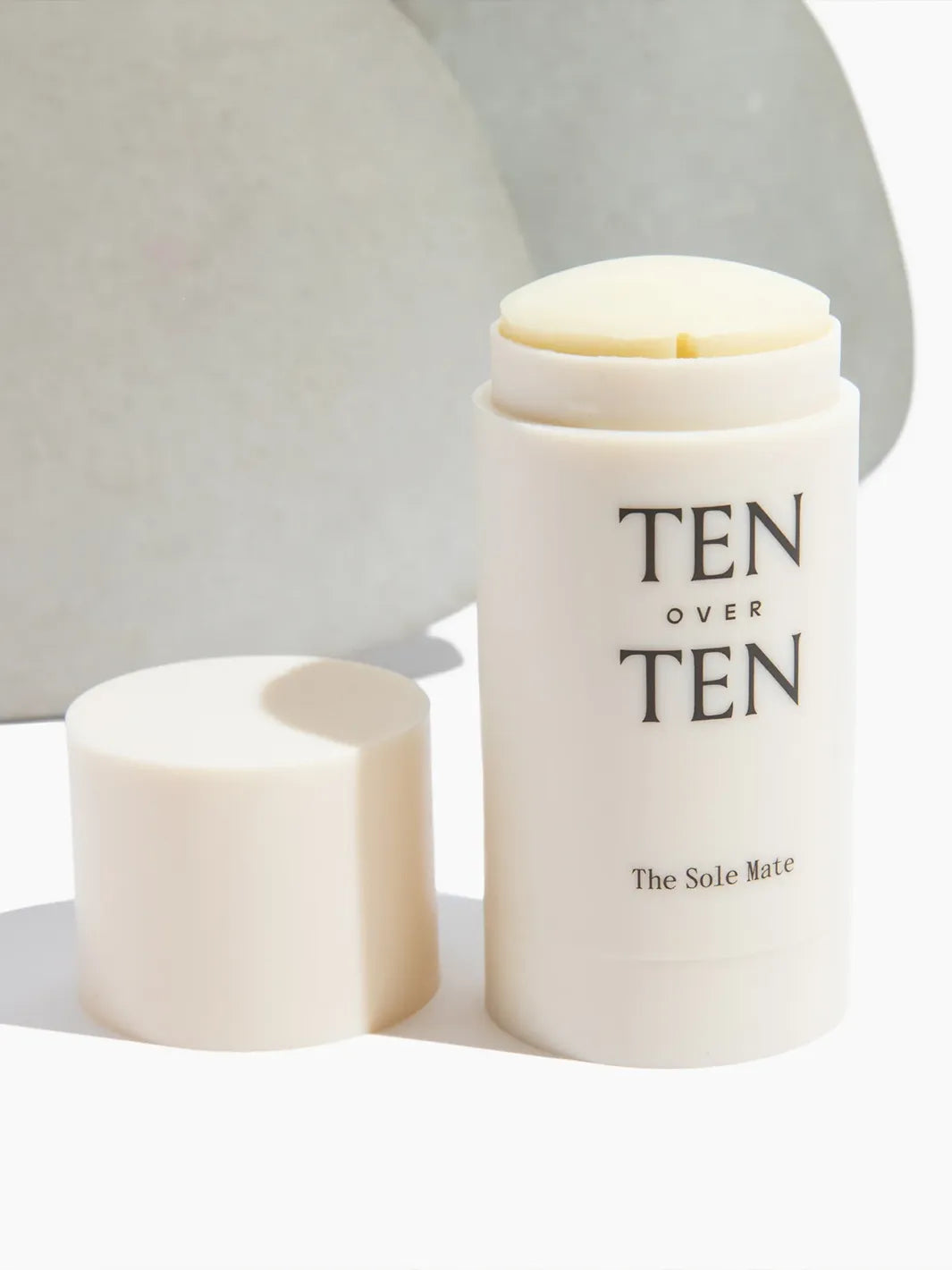 TENOVERTEN The Sole Mate foot balm stick with cap removed in natural light | Twentyseven Toronto