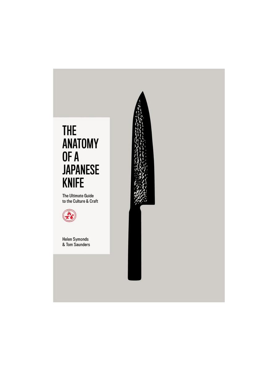 Front cover of The Anatomy of a Japanese Knife by Helen Symonds and Tom Saunders, featuring a large, textured black knife silhouette centered on a grey background, with a white title block on the left side including the subtitle "The Ultimate Guide to the Culture & Craft." | Twentyseven Toronto