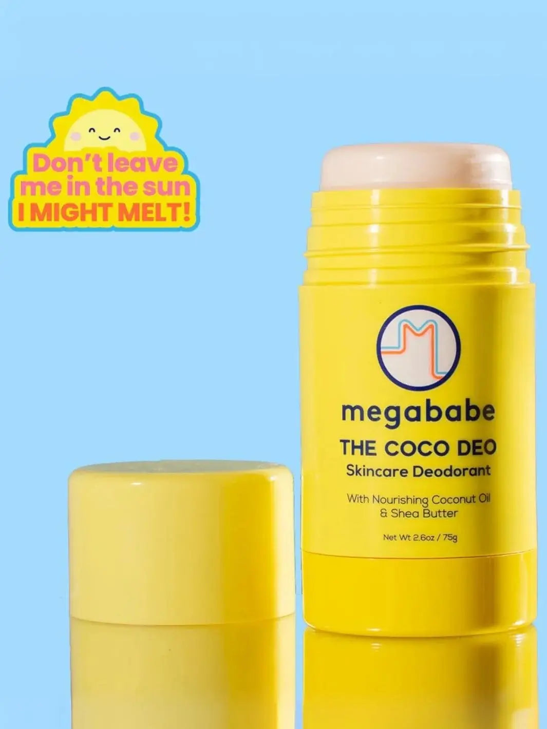 An opened yellow deodorant stick is displayed against a solid light blue background with a warning not to leave it in the sun, showcasing the premium packaging of the Megababe The Coco Deo | Twentyseven Toronto