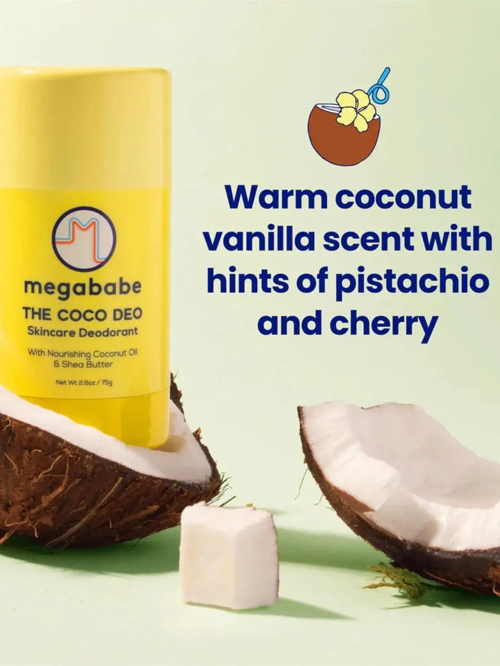 A yellow deodorant stick sits nestled inside a cracked, fresh coconut shell alongside text describing the warm fragrance profile of the Megababe The Coco Deo | Twentyseven Toronto
