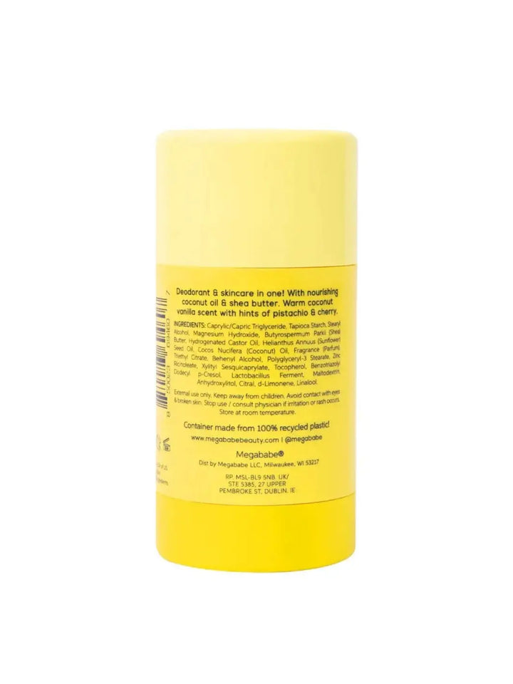 The yellow back label of a deodorant stick is pictured vertically to provide a clear view of the ingredients list and details for the Megababe The Coco Deo | Twentyseven Toronto