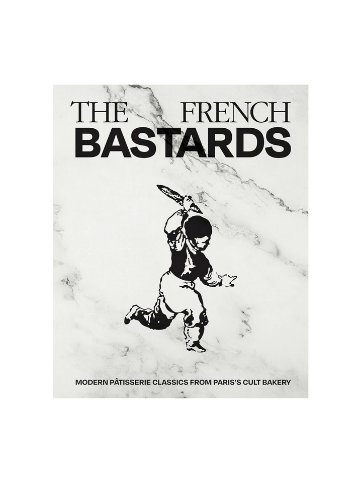 The front cover of The French Bastards cookbook, featuring a black-and-white marble background and a stylized graphic of a person running with a baguette | Twentyseven Toronto