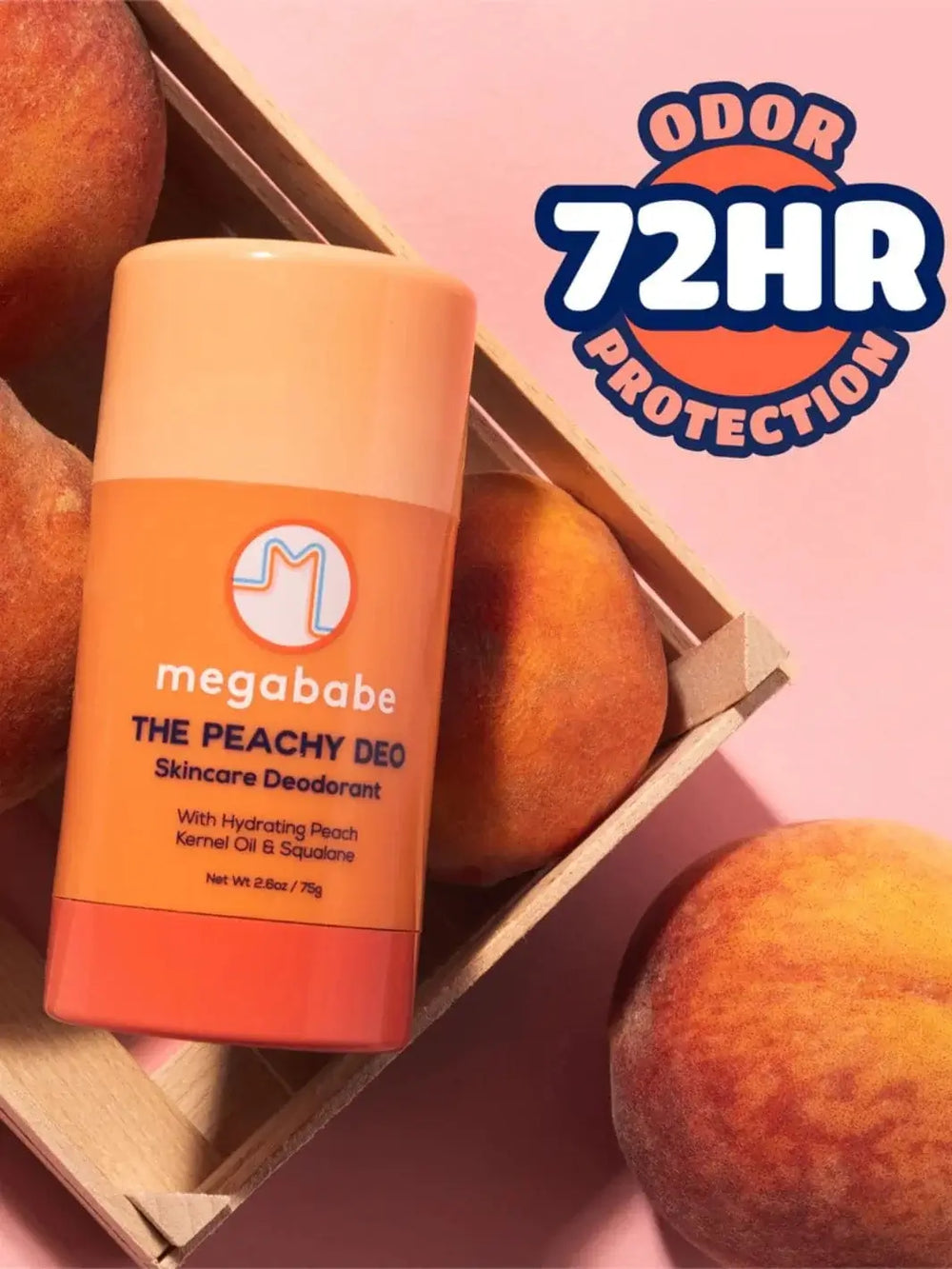 A stick of Megababe The Peachy Deo leans against a wooden crate filled with fresh peaches under a badge that reads "Odor 72HR Protection" | Twentyseven Toronto