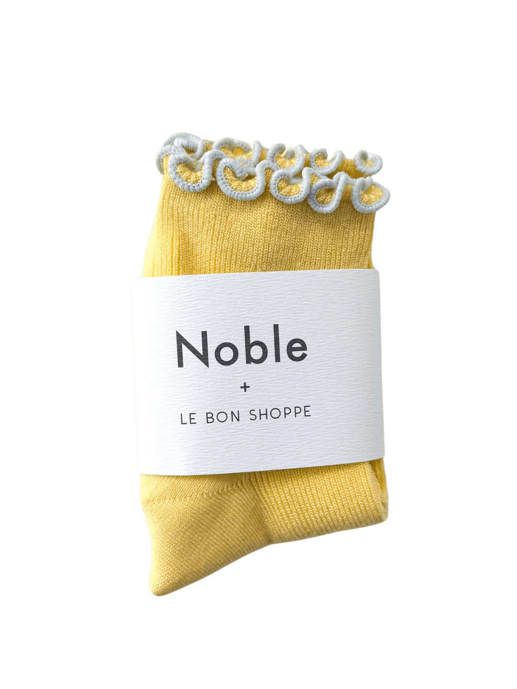 A pair of The Petite Ruffled Modal Socks in Butter / Baby Blue from Le Bon Shoppe is displayed with its white "Noble + LE BON SHOPPE" collaborative packaging band | Twentyseven Toronto