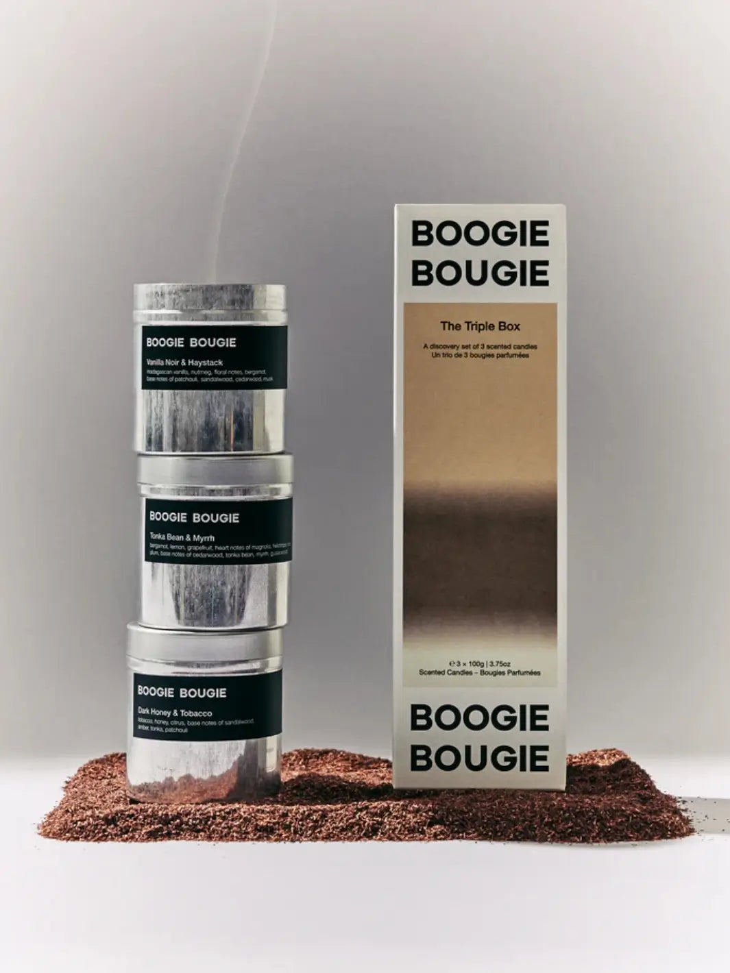 Three Boogie Bougie boxes, 'The Triple Box While Summer Shifts' candle gift set on a gray background | Twentyseven Toronto