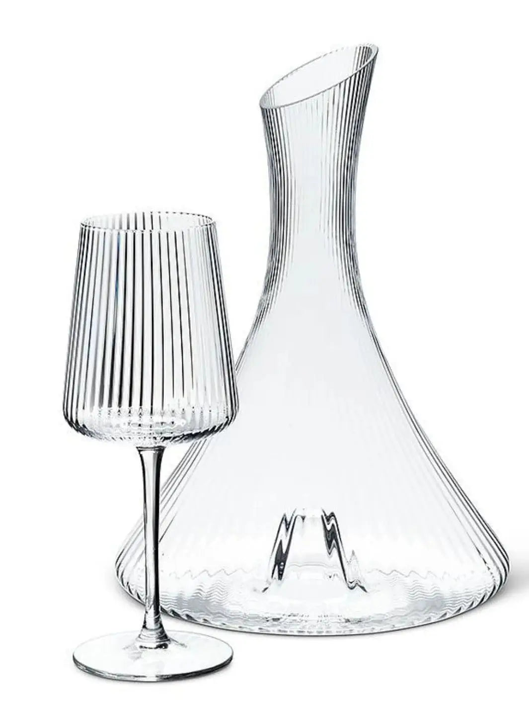 An empty, ribbed clear glass Abbott Collection Tight Optic Wine Glass is displayed next to a matching large wine decanter against a plain white background | Twentyseven Toronot