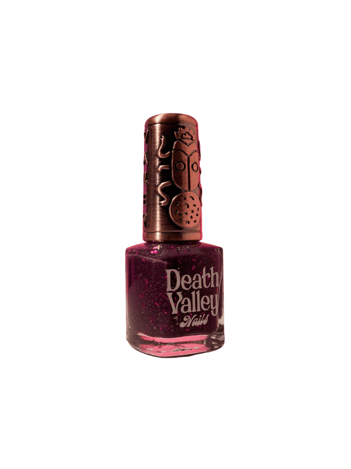 Purple bottle of 'Till Death Do Us Part' nail polish by Death Valley Nails with decorative cap on a transparent background | Twentyseven Toronto