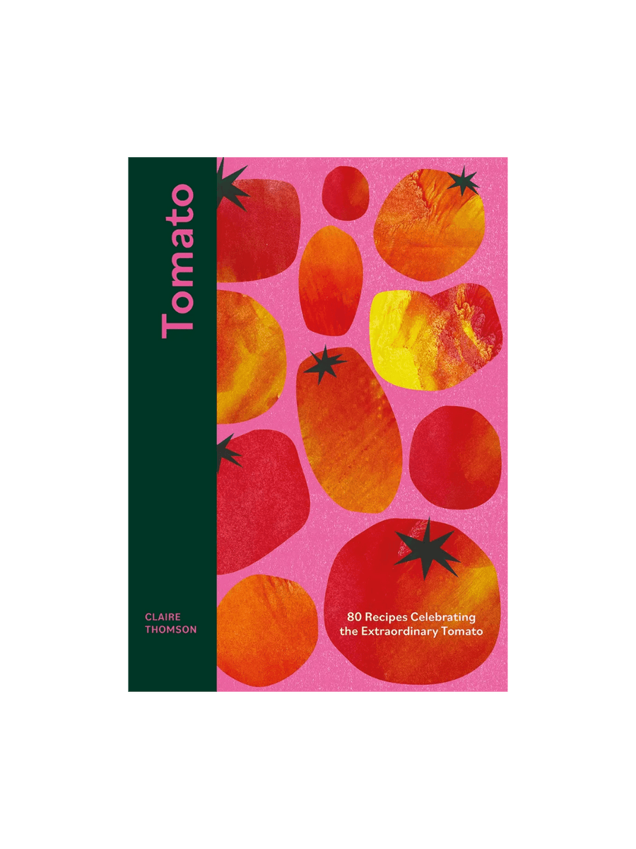 Book cover of Tomato: 80 Recipes Celebrating the Extraordinary Tomato by Claire Thomson features a playful, artistic pink background with stylized, block-print tomato shapes in red, orange, and yellow | Twentyseven Toronto