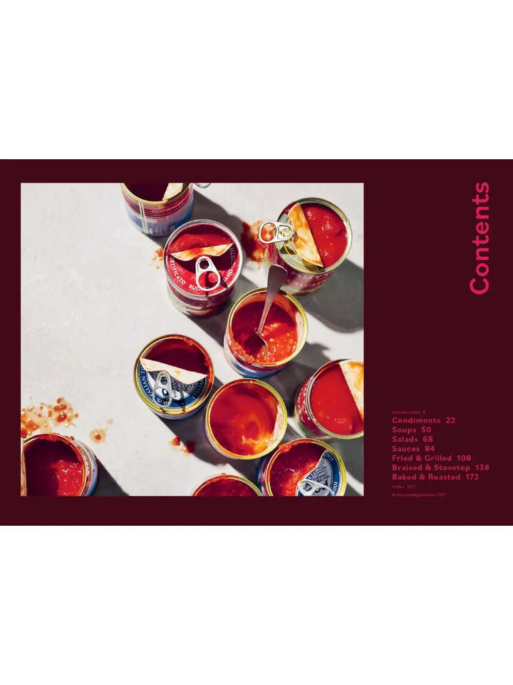 Top view photograph of several open cans filled with bright red tomato sauce is shown next to the contents page from Tomato: 80 Recipes Celebrating the Extraordinary Tomato by Claire Thomson | Twentyseven Toronto
