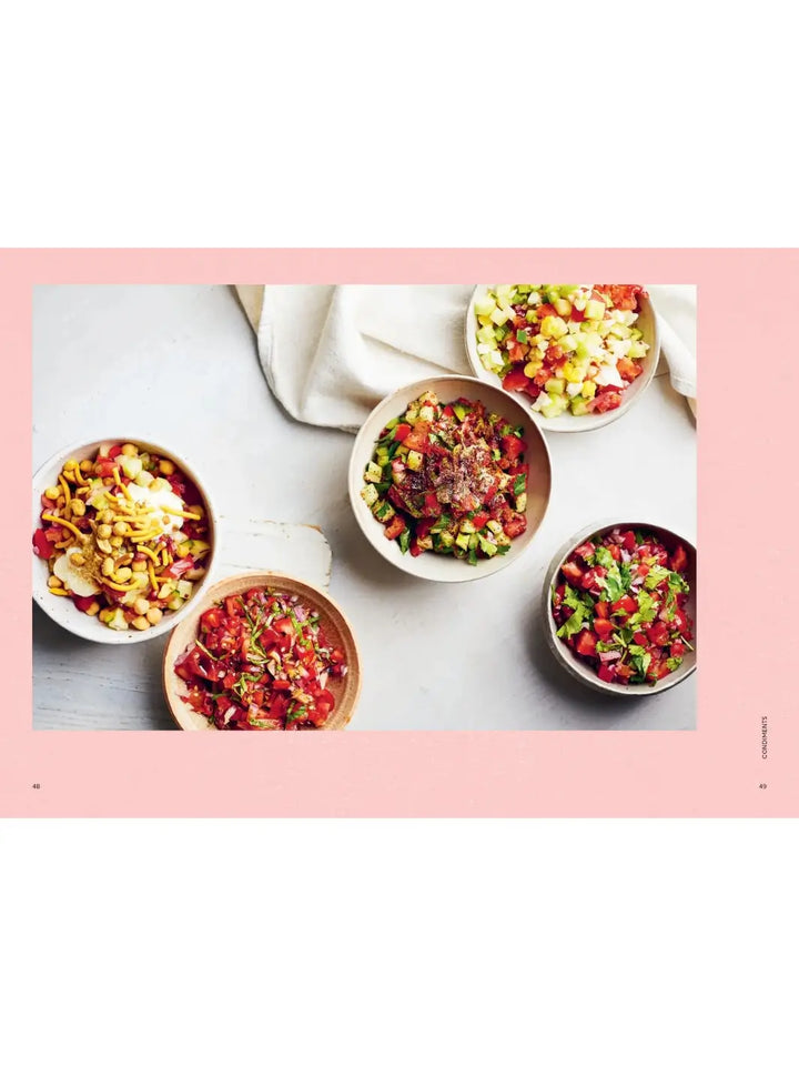 A full-page spread from Tomato: 80 Recipes Celebrating the Extraordinary Tomato by Claire Thomson showcases five different vibrant tomato-based salsas and salads served in individual ceramic bowls | Twentyseven Toronto