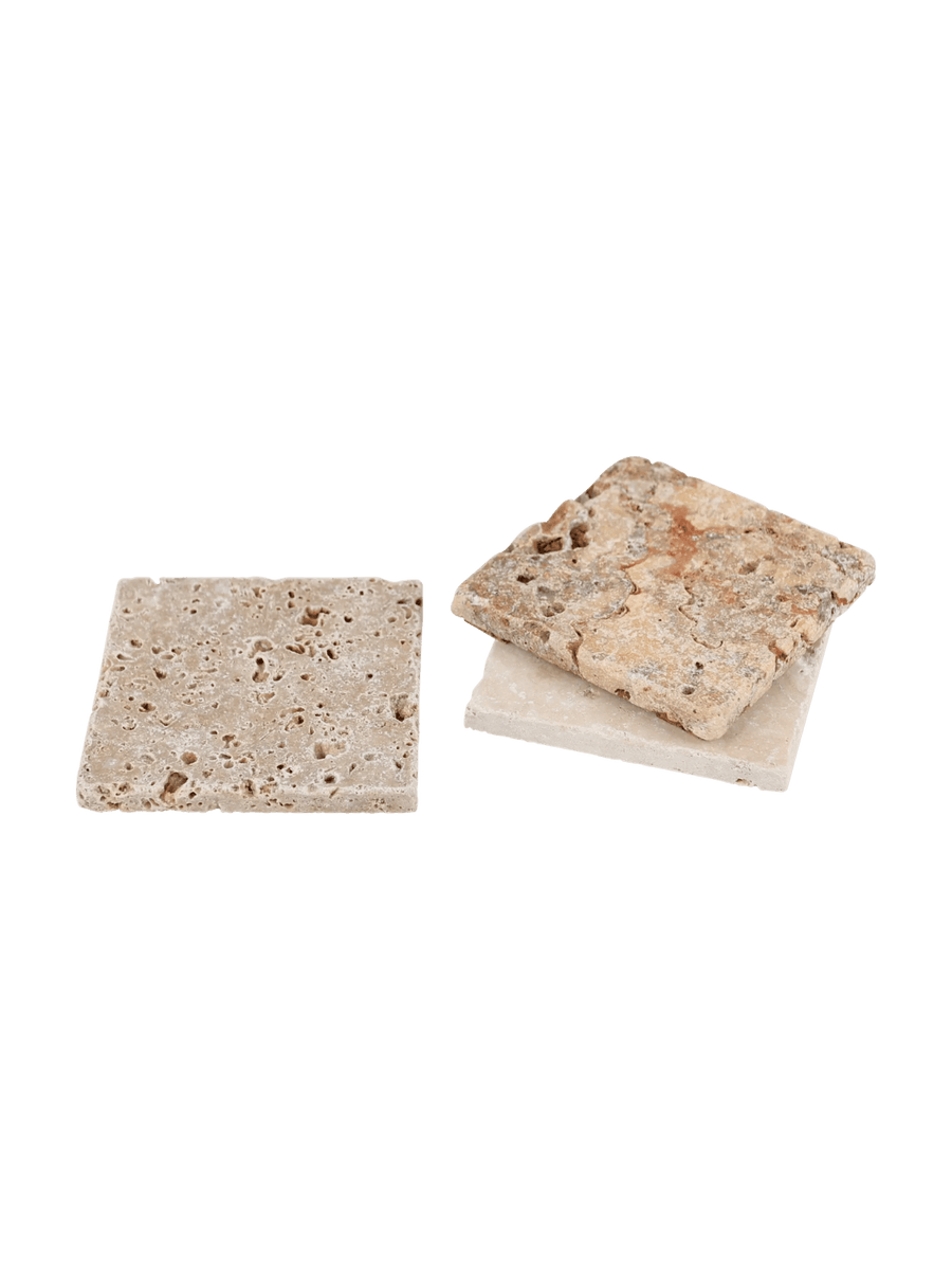 Three assorted travertine soap dishes from Burstenhaus Redecker on a transparent background | Twentyseven Toronto
