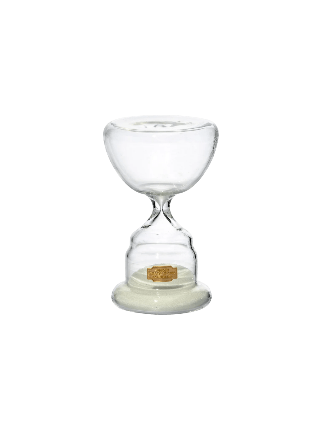 Clear glass Trophy Shaped Sandglass White No.3 from Puebco, featuring white sand collected at the base and a tiny gold logo label | Twentyseven Toronto