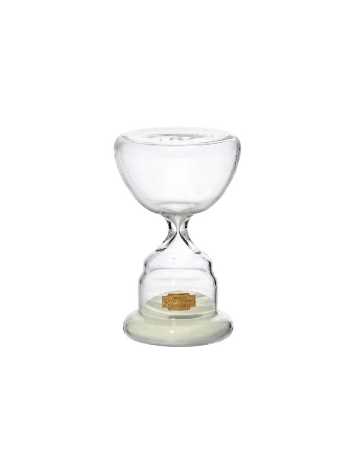 Clear glass Trophy Shaped Sandglass White No.3 from Puebco, featuring white sand collected at the base and a tiny gold logo label | Twentyseven Toronto