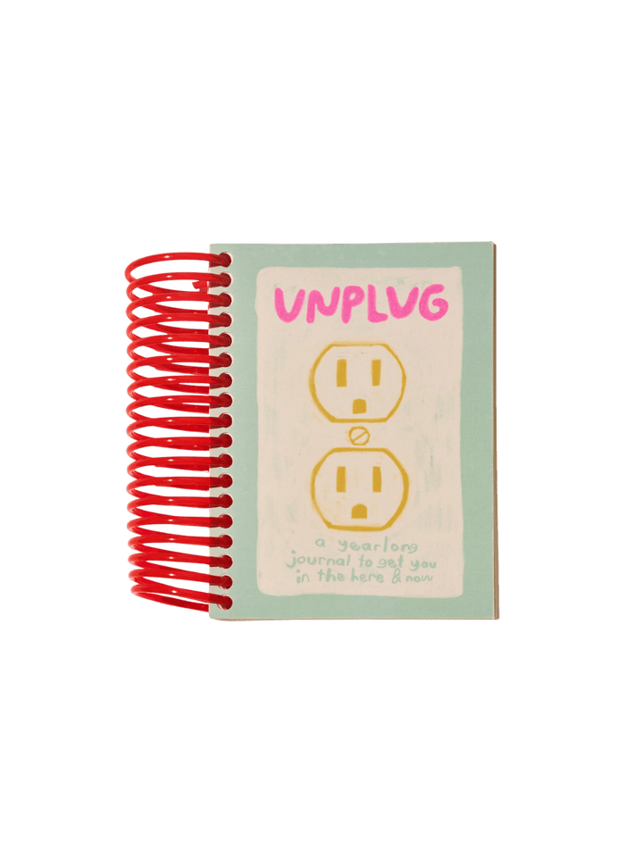 Front cover of the red spiral-bound Unplug Journal from People I've Loved, which features a drawing of an electrical outlet | Twentyseven Toronto