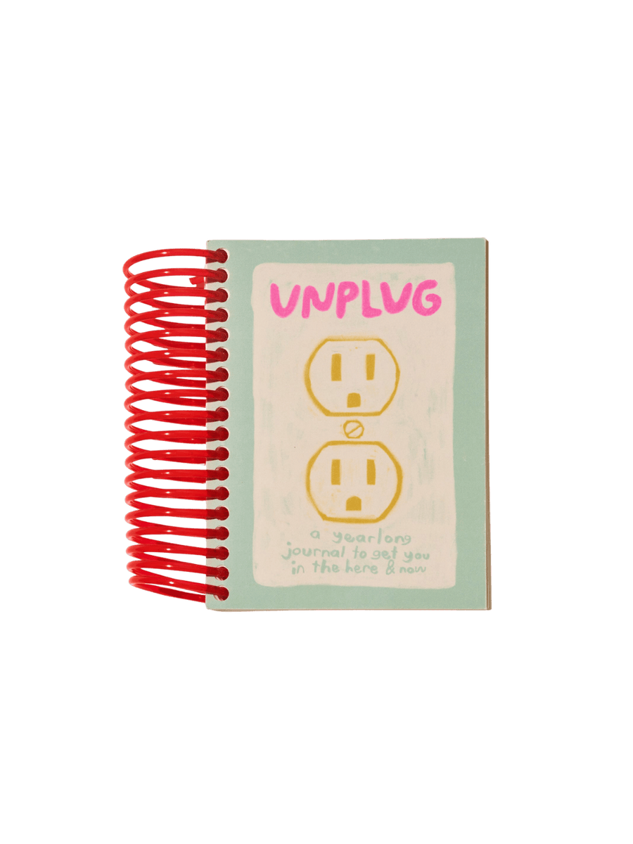 Front cover of the red spiral-bound Unplug Journal from People I've Loved, which features a drawing of an electrical outlet | Twentyseven Toronto