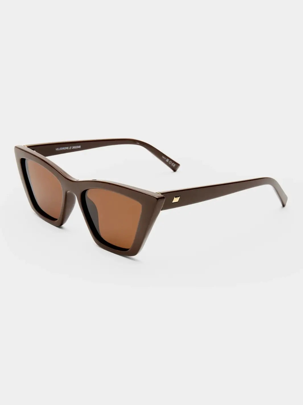 A three-quarter studio product shot of the Le Specs Velodrome - Cocoa sunglasses showing their dark brown cat-eye frame and lighter brown tinted lenses | Twentyseven Toronto