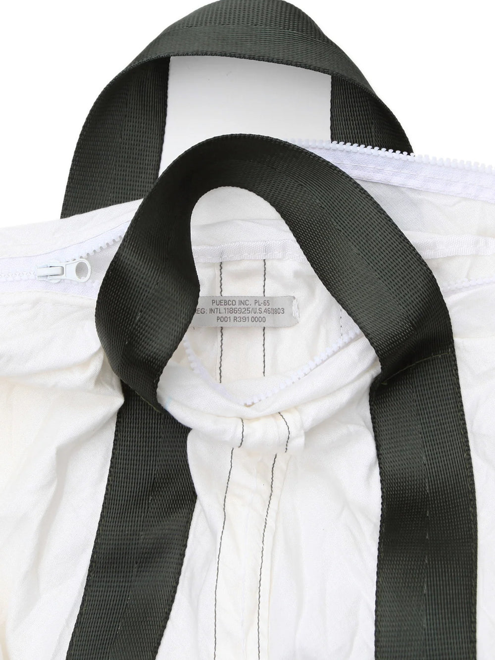 Close-up of the Puebco Vintage Parachute Tote Bag, highlighting its black woven handles, white zipper closure, reinforced stitching and Puebco label | Twentyseven Toronto
