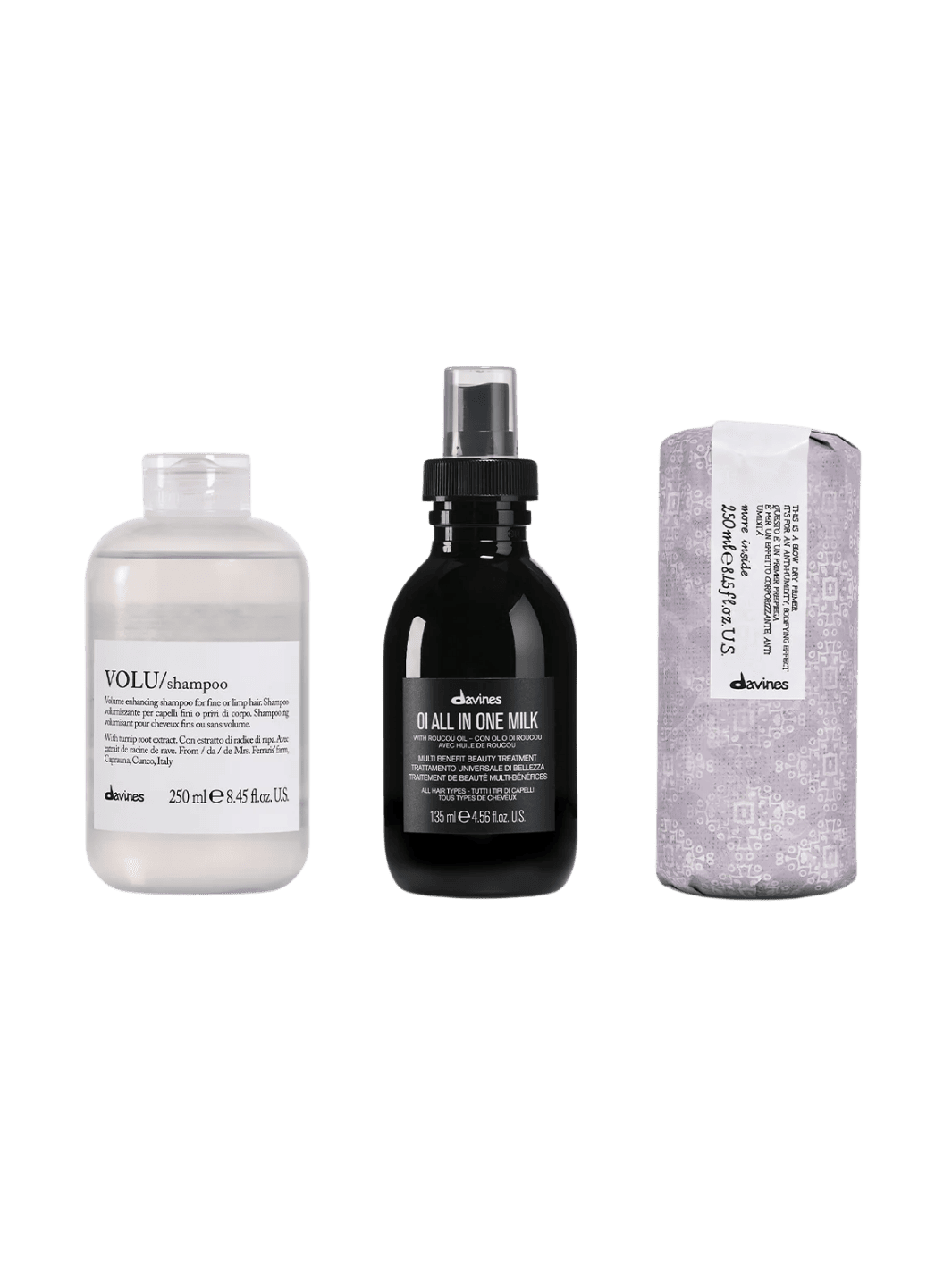 Set of three Davines hair care products including VOLU Shampoo 250ml, OI All in One Milk 135ml, This is a Blow Dry Primer 250ml on a transparent background | Twentyseven Toronto