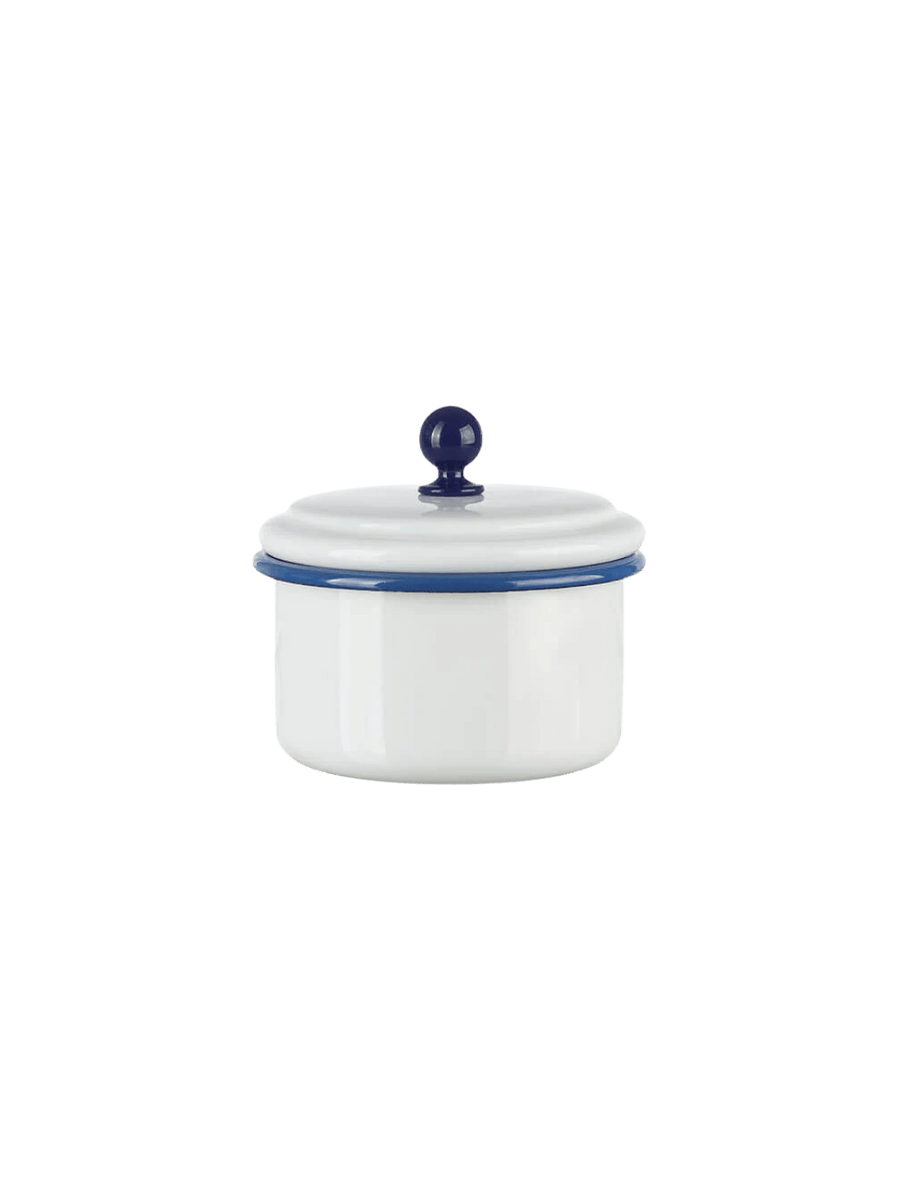 A small, round white enamel storage container featuring a dark blue rim and a matching blue spherical knob on its lid, showcasing the Munder Email White/Blue Small Storage Container | Twentyseven Toronto