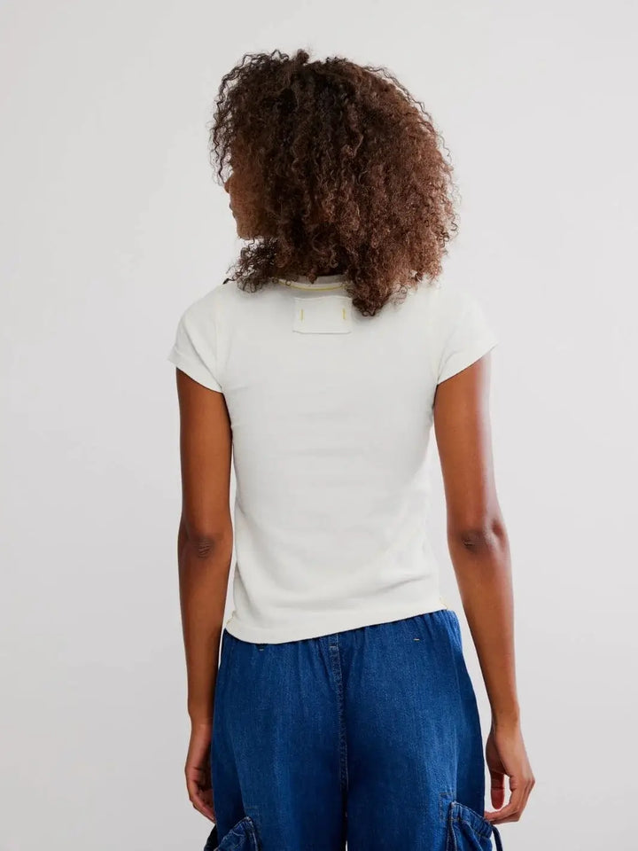 A view from behind highlights the fabric tag detailing below the collar and the simple, seamless back design of the Free People Wild Country Tee - Colorado Combo | Twentyseven Toronto