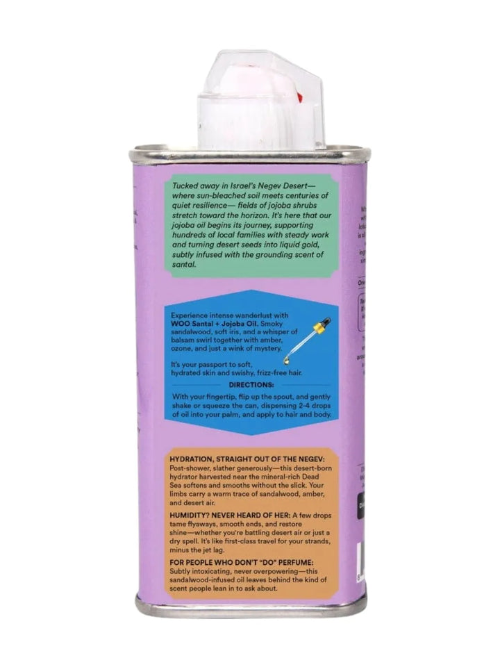 Back label of a purple tin can of WOO World of Oils Organic Santal + Jojoba Oil with a colourful label | 3.4 oz | 100 ml | Twentyseven Toronto