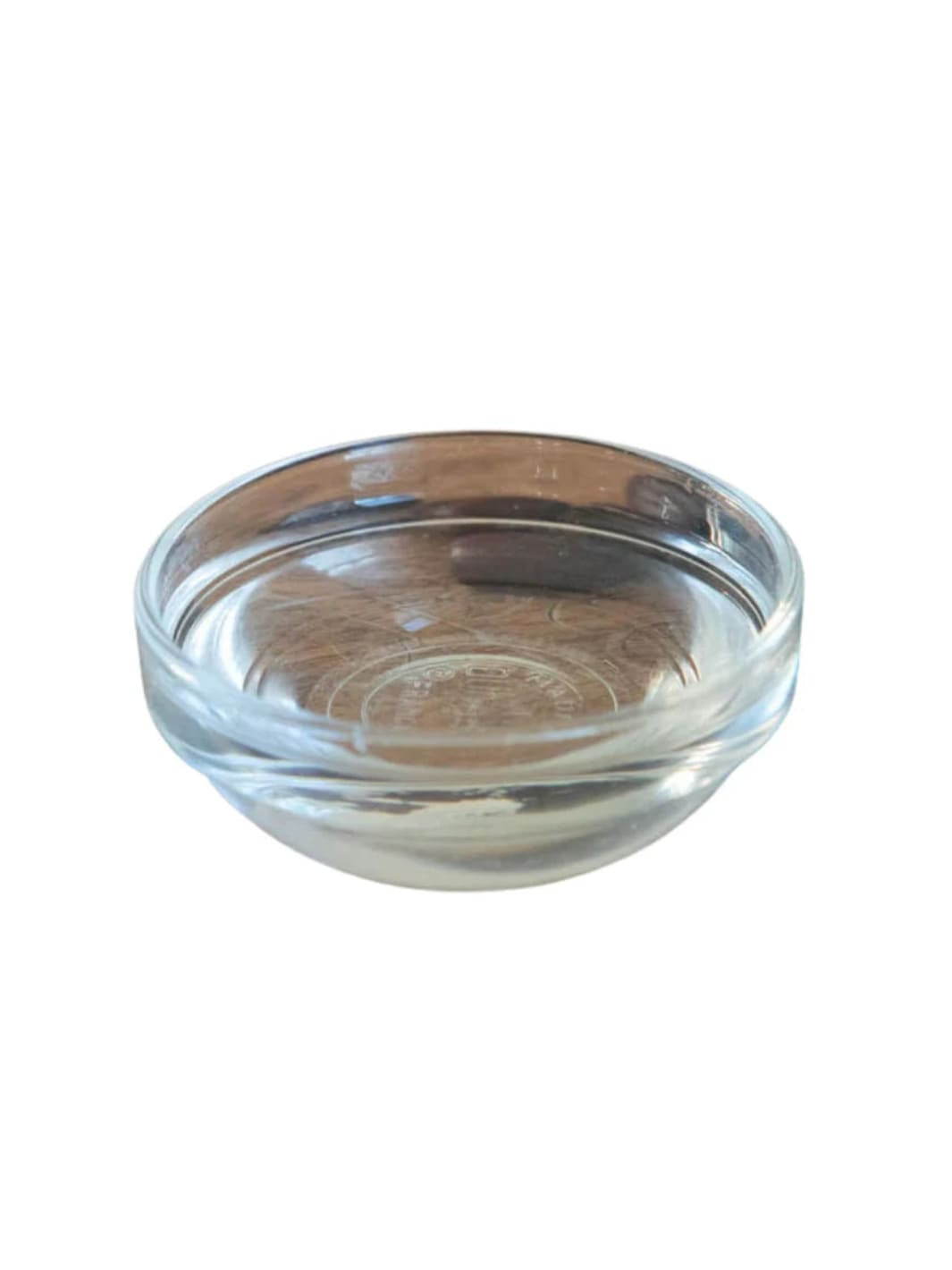 Clear glass bowl of WOO World of Oils Santal + Jojoba Oil, 3.4oz 100ml | Twentyseven Toronto