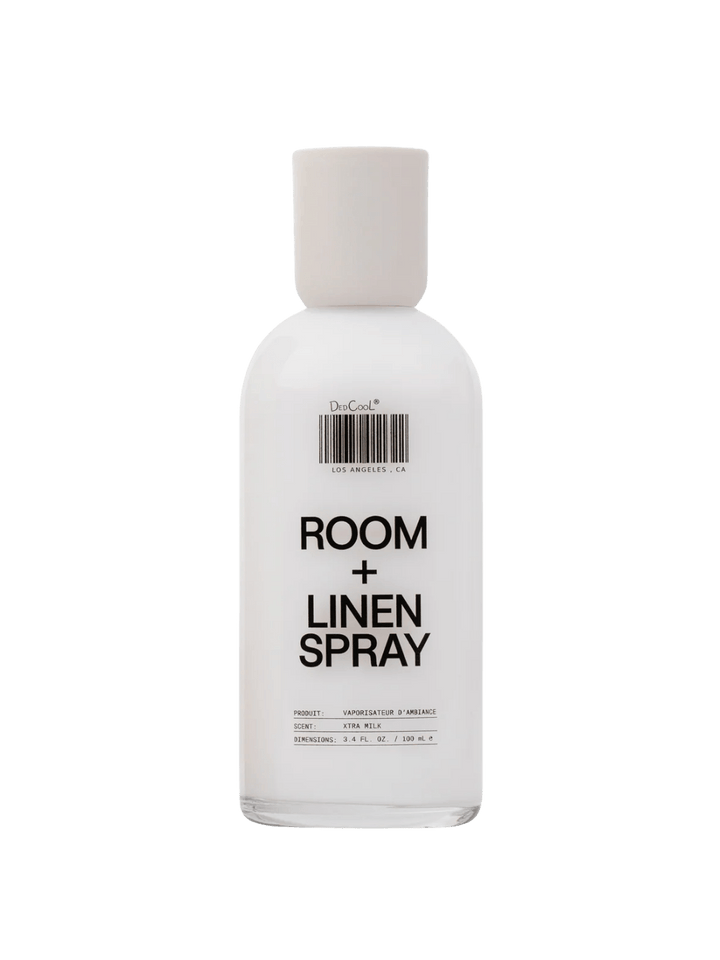Awhite bottle of Dedcool Room + Linen Spray in Xtra Milk against a transparent background | Twentyseven Toronto