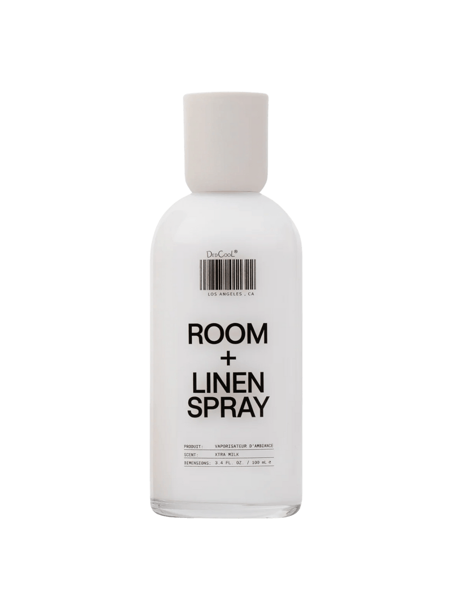 Awhite bottle of Dedcool Room + Linen Spray in Xtra Milk against a transparent background | Twentyseven Toronto