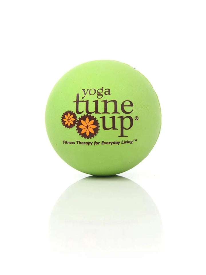 Close up of green therapy massage ball from Tune Up Fitness on a white background | Twentyseven Toronto