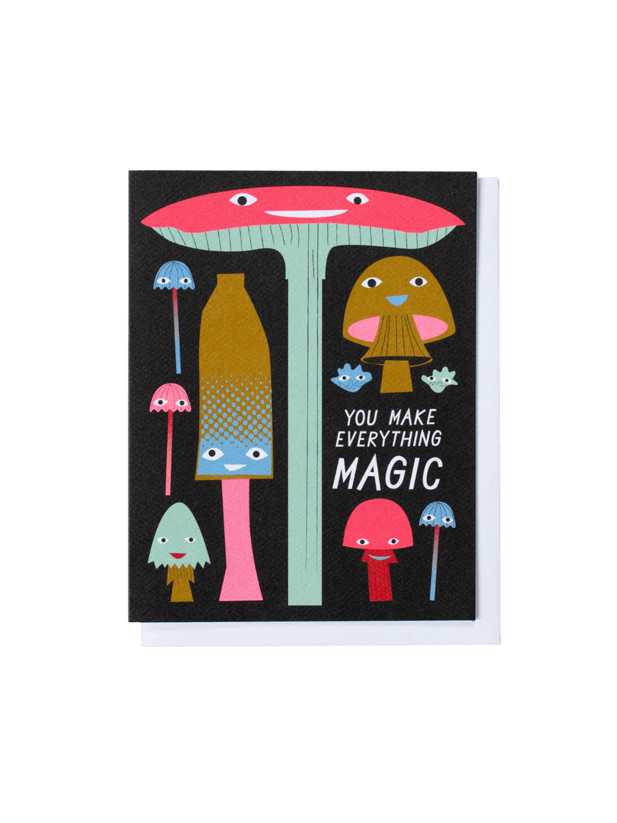 The front of the Banquet Workshop You Make Everything Magic Mushrooms Note Card features a whimsical illustration of various colourful, friendly-faced mushrooms on a dark textured background next to the white printed text "YOU MAKE EVERYTHING MAGIC" | Twentyseven